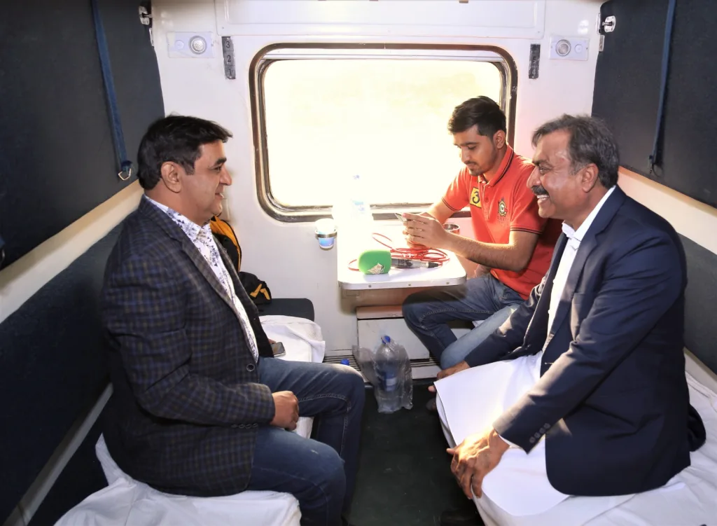 Men in Thar Desert Train Safari Business Class Cabin